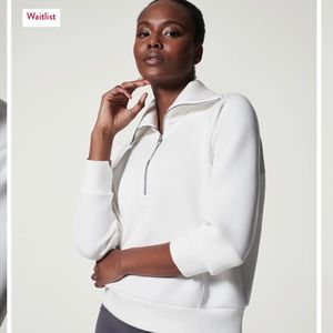 Spanx AirEssentials half zip in powder white. Sz M.